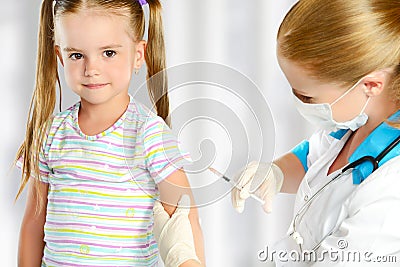 Doctor a pediatrician makes child vaccinated Stock Photo