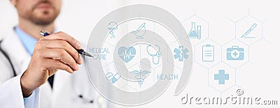 Doctor with a pen pointing medical icons on touchscreen Stock Photo