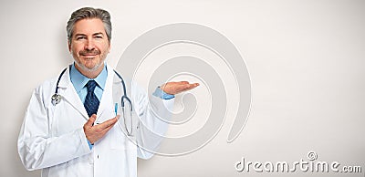 Doctor pharmacist presenting gray background Stock Photo