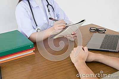 Doctor physician consulting with male patients in hospital exam room. Men`s health concept Stock Photo