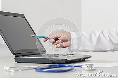 Doctor Pointing To The Computer Screen Stock Photo