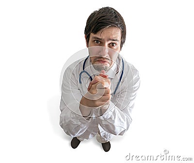 Doctor is praying, begging or asking for help. Stock Photo