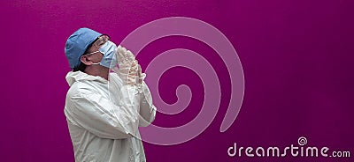 Doctor praying for the sick of the world Stock Photo