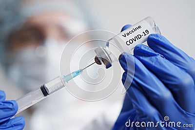 Doctor Prepares the Syringe for Vaccination COVID-19 Stock Photo