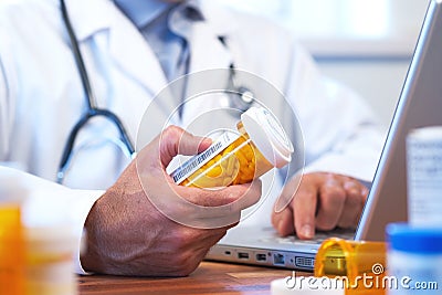 Doctor preparing online internet prescription Stock Photo