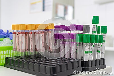 Doctor preparing patient for blood sampling. Focus on blood test tools on table Editorial Stock Photo