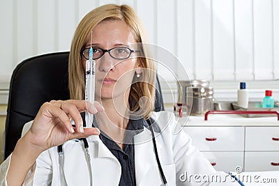 Doctor Preparing Syringe For Vaccination in Clinic Stock Photo