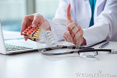 The doctor with prescribed medicines in medical concept Stock Photo