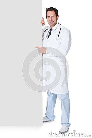 Doctor presenting empty banner Stock Photo