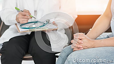 Doctor or psychiatrist consulting and diagnostic examining stressful woman patient on obstetric - gynecological female illness Stock Photo