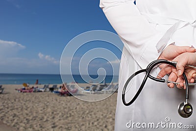 The doctor put his hands with stethoscope behind his back on a b Stock Photo