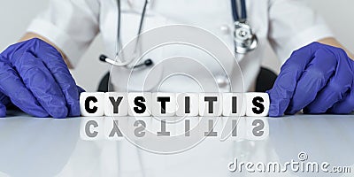 The doctor put together a word from cubes CYSTITIS Stock Photo