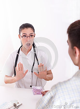 Doctor refusing bribing Stock Photo