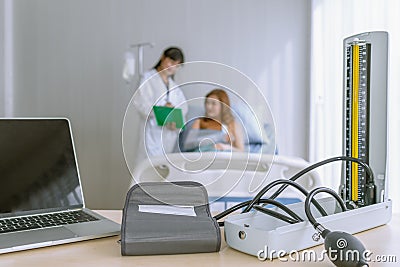 The doctor reported the results of the blood pressure monitor. presenting results symptom and recommend treatment method, Stock Photo