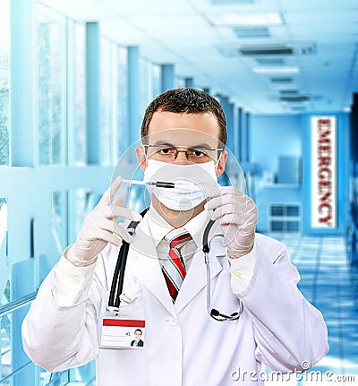 Doctor resarch a medical test syringe with blood. Stock Photo