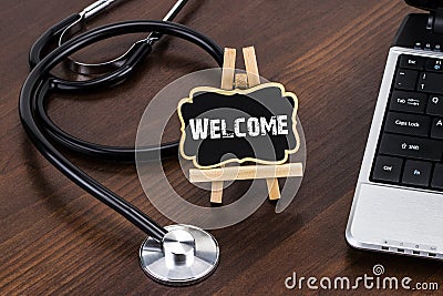 The doctor`s desk with stethoscope and red heart and blackboard Stock Photo