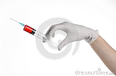 Doctor's hand holding a syringe, white gloved hand, a large syringe, the doctor makes an injection, white background Stock Photo