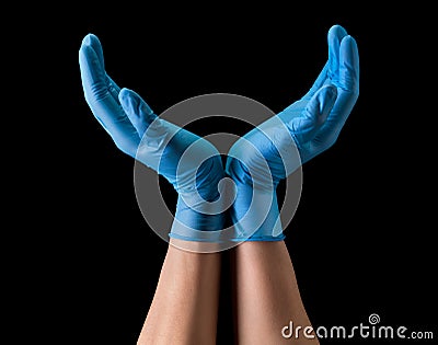 Doctor`s hand in sterile medical gloves hold earth shape on black Stock Photo