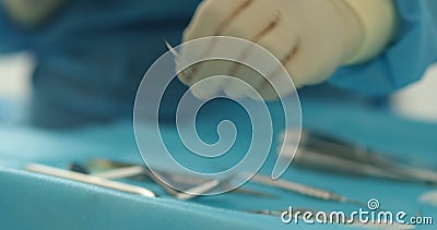 Doctor's hands with a working tool. Preparation and process of dental treatment. Stock Photo