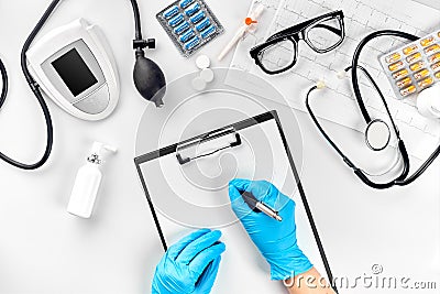 Doctor s table, tools, medical instruments, therapist tonometer, blood pressure, work in hospital on white background Stock Photo