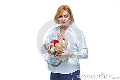 The doctor schematically on the layout shows the process of passing the child through the birth canal of a woman Stock Photo