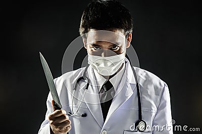 Doctor Serial Killer psychosis hold knife Stock Photo