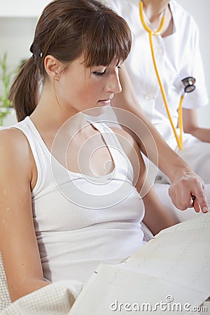 Doctor showing patient cardiogram Stock Photo