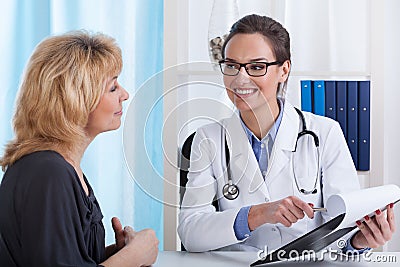 Doctor showing patient's test results Stock Photo