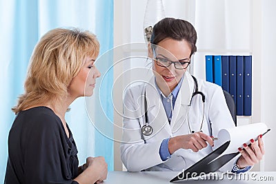 Doctor showing patient test results Stock Photo