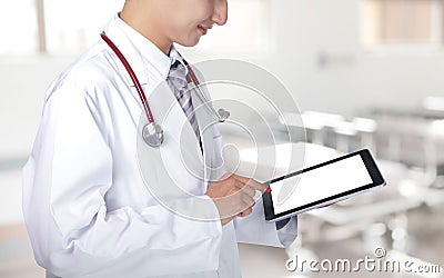 Doctor showing tablet pc in hospital Stock Photo