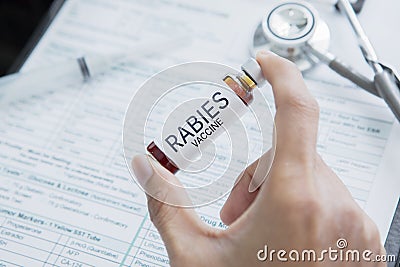 Doctor shows ampule with word of Rabies Vaccine Stock Photo