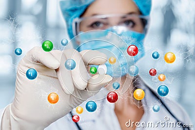 Doctor shows a pill containing a large amount of vitamins Stock Photo