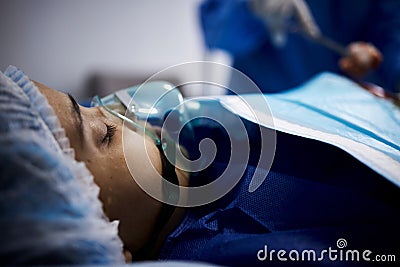 Doctor, sleeping or sick woman with an oxygen mask or respiratory for healthcare recovery in hospital bed. Medical Stock Photo