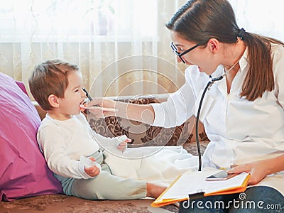 A doctor and a small child. first meeting with a doctor. doctor at home. call at the address Stock Photo