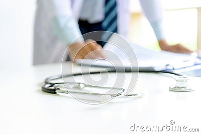 Doctor stand on the table with x ray film Stock Photo