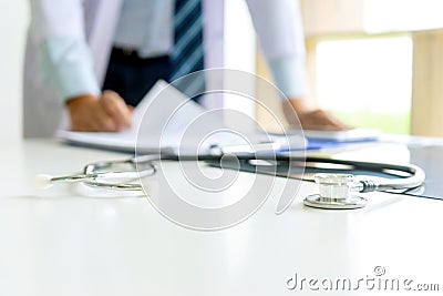 Doctor stand on the table with x ray film Stock Photo