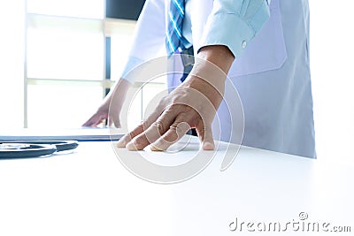 Doctor stand on the table with x ray film Stock Photo