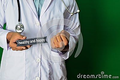 Doctor standing on Green background. Selective focus in hand. healthy and happy paper text. Stock Photo