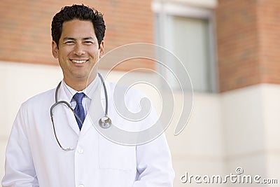 Doctor Standing Outside A Hospital Stock Photo
