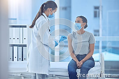 Doctor sterilise the arm of patient with cotton. Doctor wiping a patients arm for injection. Doctor about to inject Stock Photo