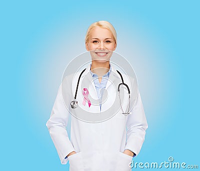 Doctor with stethoscope, cancer awareness ribbon Stock Photo