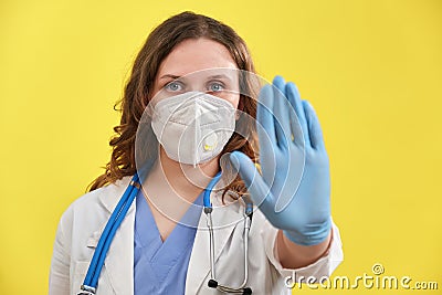 Doctor stop gesture stopping coronavirus disease, close-up. Influenza virus epidemic medication counter concept - stay home Stock Photo