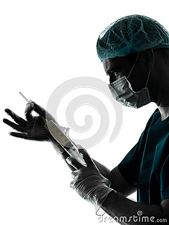 Doctor surgeon Anesthetist man holding surgery needle silhouette Stock Photo
