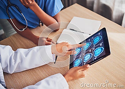 Doctor, tablet and brain xray, neurology and digital test results, people and healthcare team in hospital. MRI Stock Photo