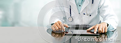 Doctor with tablet computer at hospital office Stock Photo