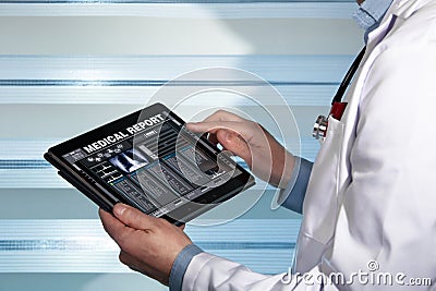 Doctor with tablet data consulting a medical report of a patient Stock Photo