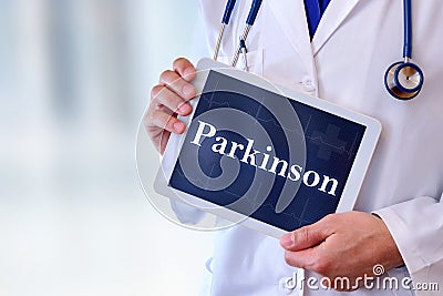 Doctor with tablet with parkinson message Stock Photo