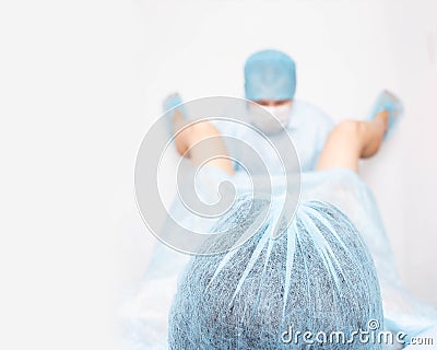 The doctor takes difficult childbirth from the girl. Pathology in carrying a fetus during pregnancy in women. Umbilical cord fetus Stock Photo