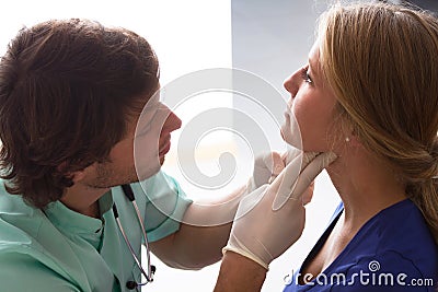 GP examining woman Stock Photo