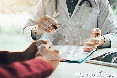 Doctor talking to the patient about menopause and treatment in f Stock Photo